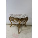 A CARVED GILTWOOD CONSOLE TABLE,