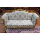 A CARVED GILTWOOD SOFA, in French Louis Seize style,