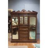 A LATE 19th CENTURY MAHOGANY AND WALNUT VENEERED WARDROBE, bearing label for A.