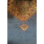 AN ARTS AND CRAFTS STYLE RECTANGULAR WOOL RUG,