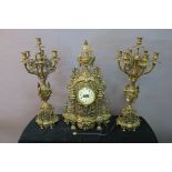 A CONTINENTAL STYLE GILT BRASS CLOCK GARNITURE,