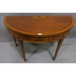 A SHERATON STYLE MAHOGANY AND SATINWOOD CROSSBANDED SIDE TABLE, of demi-lune outline,