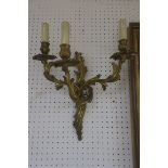 A PAIR OF CONTINENTAL STYLE GILT BRASS FRAMED THREE BRANCH APPLIQUE