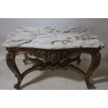 A CONTINENTAL CARVED GILTWOOD AND MARBLE TOP TABLE,