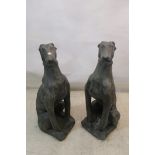 A PAIR OF COMPOSITION GREY PAINTED SEATED LURCHERS,