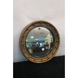 A GEORGIAN STYLE GILT FRAMED CONVEX MIRROR,