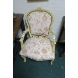 A FRENCH CREAM PAINTED AND UPHOLSTERED ARMCHAIR,