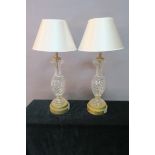 A PAIR OF CONTINENTAL CUT GLASS AND BRASS TABLE LAMPS,