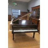 A DANEMANN BOUDOIR GRAND PIANO, raised on square tapering spade legs with castors,
