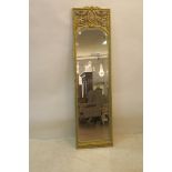A CONTINENTAL GILTWOOD AND POLYCHROME MIRROR,