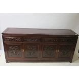 A CHINESE CARVED ROSEWOOD SIDEBOARD,