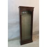 A MAHOGANY AND GLAZED DOOR DISPLAY CABINET,