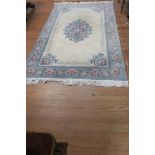 A PERSIAN HAND KNOTTED WOOL RUG,