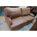 A GOOD HIDE UPHOLSTERED SETTEE,