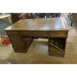 A WALNUT PEDESTAL DESK,