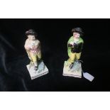 A PAIR OF 19th CENTURY STAFFORDSHIRE PAINTED GLAZED PORCELAIN FIGURES,