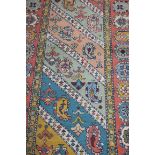 A PERSIAN WOOL RUNNER, the light blue,