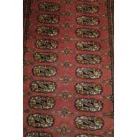 A BOKHARA WOOL RUNNER,