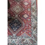 AN INDIAN WOOL RUG, the rust,