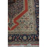 A PERSIAN WOOL RUG, the indigo,