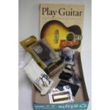 Assortment of guitar accessories including: Dunlop capo and brass slide, Schaller strap locks,