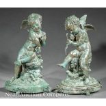 Pair of French Verdigris Patinated Bronze Cupid Figures, holding bow and quiver, oval bases, paw