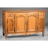 French Provincial Carved Walnut Buffet Bas, 18th c., three-plank top with molded edge, paneled