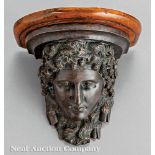 Continental Patinated Bronze Wall Bracket, 20th c., molded wood shelf, over bust of Hera crowned