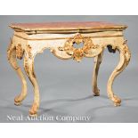 Pair of Portuguese Carved, Painted and Parcel Gilt Consoles, late 18th/early 19th c., shaped top,