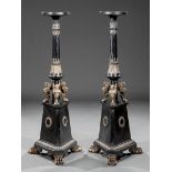 Pair of Egyptian Revival Silvered Metal and Ebonized Columnar Stands, probably French, circular top,