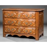 French Provincial Carved Walnut Commode, 18th c., molded serpentine top, three raised panel drawers,