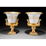 Pair of Paris Porcelain Campagna Urns, mid-19th c., gilt decorated vintage banding, and mascaron