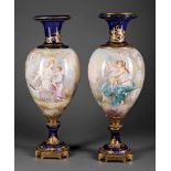 Pair of Antique French Bronze-Mounted Porcelain Urns, late 19th c., reserves painted with Cupid