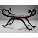 Neoclassical-Style Parcel Gilt and Ebonized Curule Bench, scrolled uprights, turned supports,