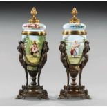 Pair of French Bronze-Mounted Porcelain Covered Urns, flame finial, tripartite cherub base, h. 19