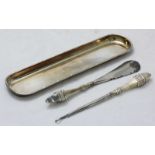 A small Edwardian silver pen tray, hallmarked Chester 1908, together with a stainless button hook