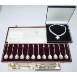 A cased set of twelve silver apostle teaspoons by 'The Birmingham Mint' together with a small