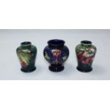 A small Moorcroft pottery 'Anemone' pattern vase of globular form, 9cm high, together with two small