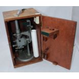 A Hilfiger & Watts refractometer with paper scale charts, in original fitted wooden box.