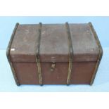 A wood and metal bound canvas trunk by 'T.Goff' with handles to each end. 85cm long.