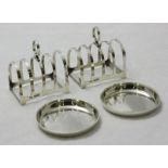 A pair of silver toast racks by C W Fletcher and Sons Ltd, hallmarked Sheffield 1936, together