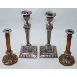 Two pairs of silver-plated candlesticks. The tallest pair measuring 31cm high. (AF)