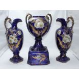 A three-piece pottery garniture set by A.G. Harley Jones of Royal Vienna, c.1907, comprising of