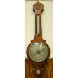 A late 19th century stained oak veneered mercury wheel barometer by W M Corke of Wolverhampton, with