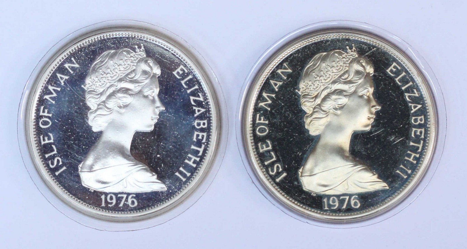 A proof standard silver crown 'Horse and Tram Centenary' 1976, together with and another 'HM Queen