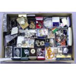 A quantity of costume jewellery including brooches, necklaces, watches and cased set of spoons