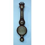 An Edwardian mercury wheel barometer with thermometer, hygrometer, small convex mirror and