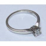 A 9 carat white gold Canadian ice solitaire diamond ring four claw set with a round brilliant cut