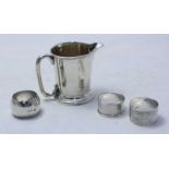 A small silver jug of tapering cylindrical form, hallmarked Birmingham 1903, together with three
