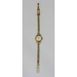 A ladies 9ct gold Tissot cocktail watch, the silvered dial with batons denoting hours and Arabic